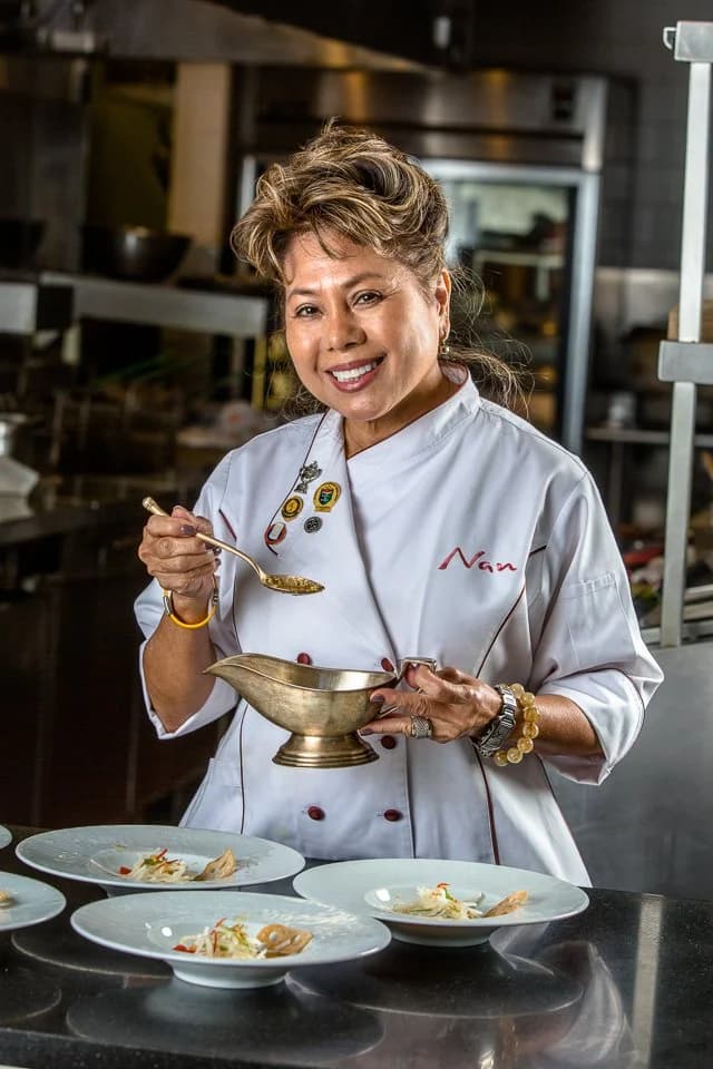 Chef Nan plating in the kitchen